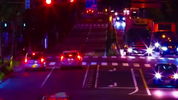 A night timelapse of traffic jam at the downtown street in Tokyo long shot panning — Stock Video