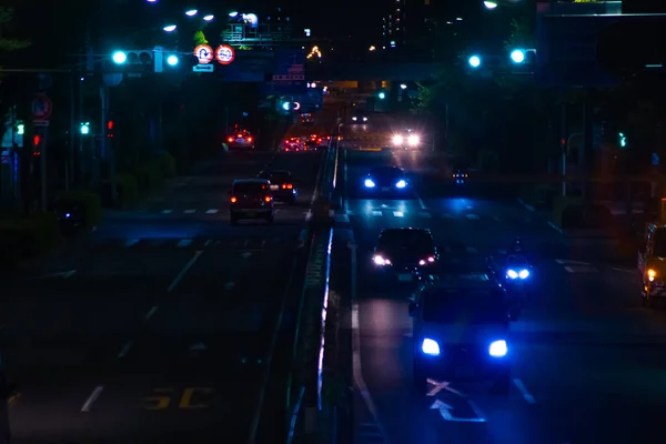 En natt nere på gatan i Tokyo långsökt — Stockfoto