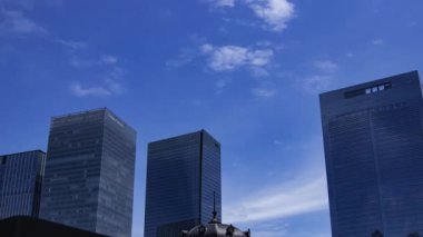 A timelapse of cloud reflecting the office building at the business town. High quality 4k footage. Chiyoda district Ootemachi Tokyo Japan 08.14.2025 It is center of the city in Tokyo. 
