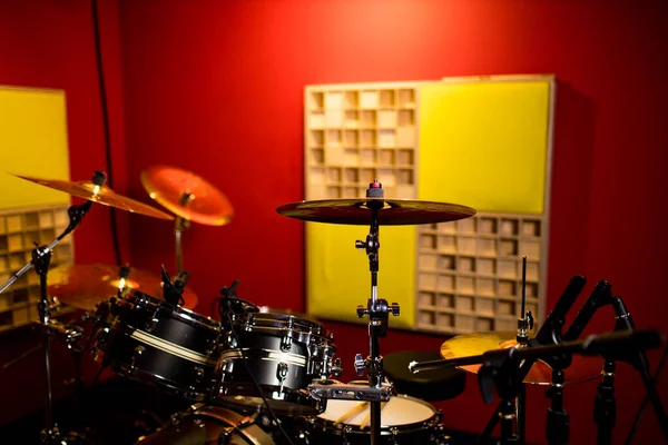 red drums studio close-up in recording studio