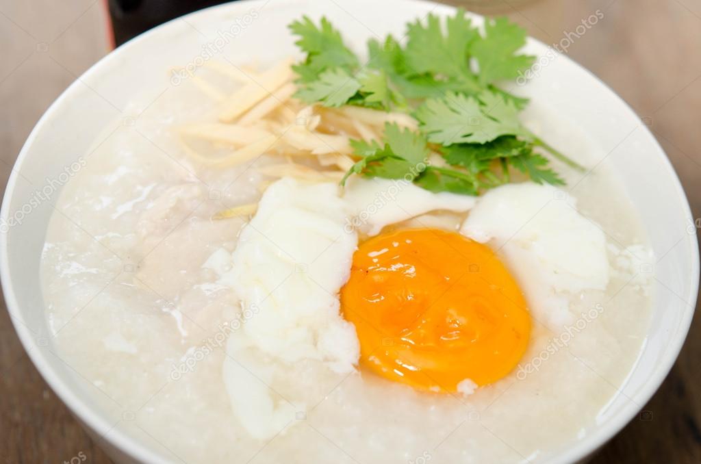 Congee of traditional food Chinese style with soft-boiled egg