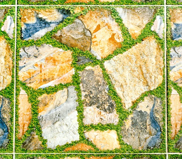 Roccia ceramica con erba verde sfondo texture — Foto Stock