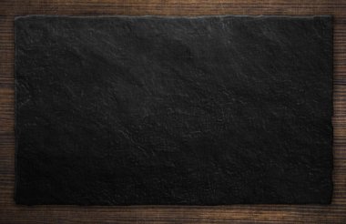 Empty stone black plate on wooden plank, background texture surface. 3d illustration
