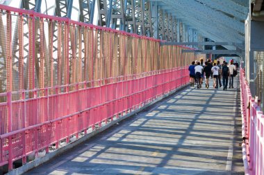 Runners Crossing Williamsburg Bridge in New York City clipart