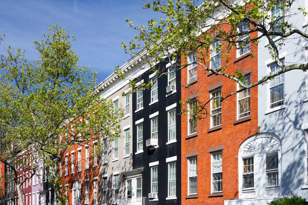 Colorful apartment buildings on Macdougal Street in the Greenwich Village neighborhood of Manhattan in New York City