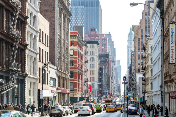 NEW YORK CITY CIRCA 2019: The streets and sidewalks are crowded with busy people in the SoHo neighborhood of Manhattan in NYC