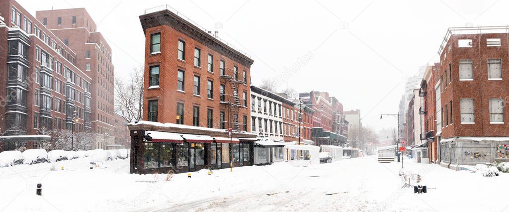 Snow covered street scene on Greenwich Avenue in the West Village of New York City after a winter blizzard