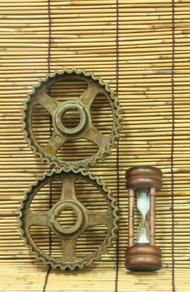 Hourglass and pinion gears — Stock Photo, Image