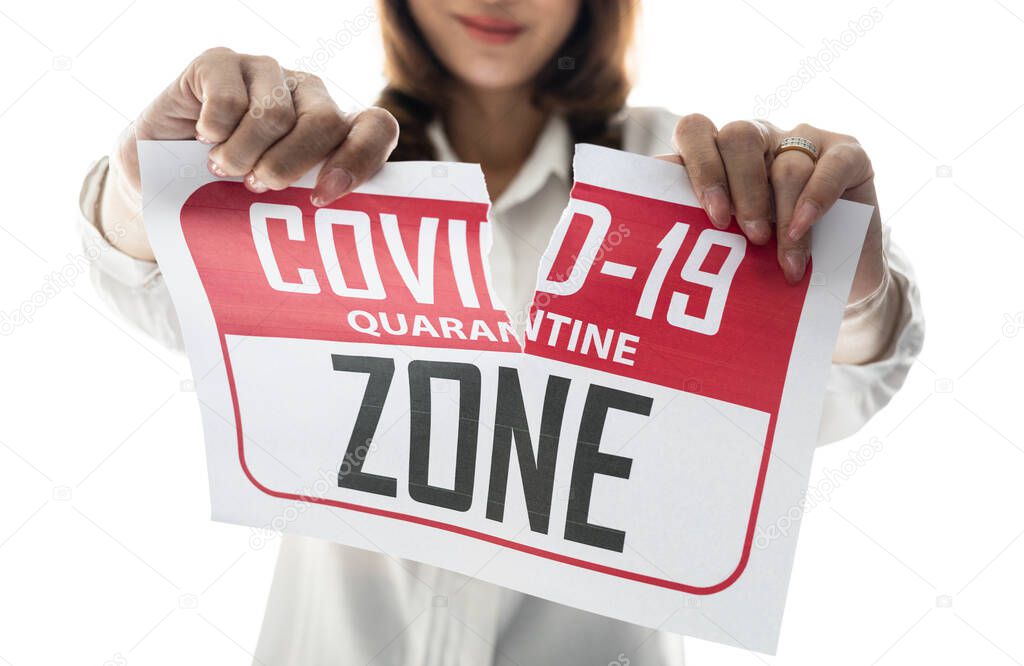 Woman holding and tearing paper with Covid-19 quarantine zone. The idea or concept for happiness, free and wellness after finishing and recovered from Coronarivus.