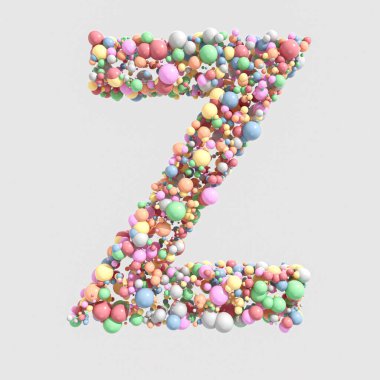 Z konsepti, izole edilmiş bir zemin üzerinde yuvarlak pastel renkli şekerlerden oluşan bir koleksiyon.
