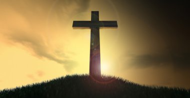 crucifixo em uma colina ao amanhecer
