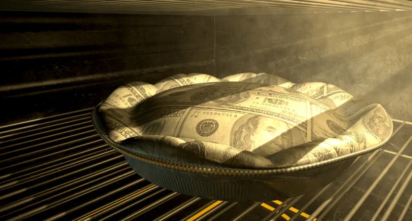 Pastel de dinero en dólares estadounidenses horneando en el horno — Foto de Stock