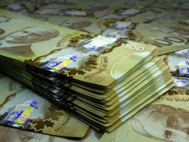 Money of Canada. Canadian dollar bills. CAD banknotes. 100 dollars. Business, finance, news background. clipart