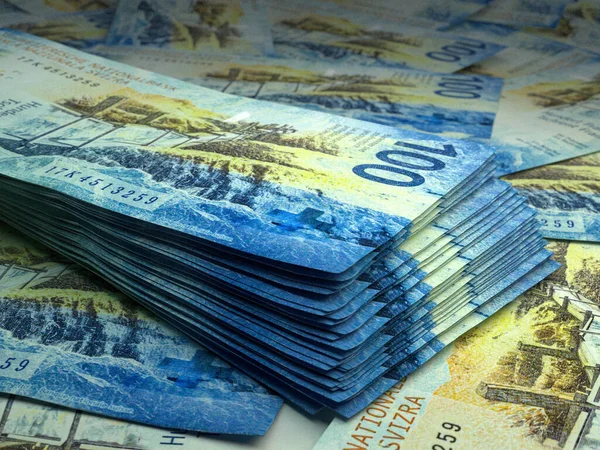 Money of Switzerland. Swiss franc bills. CHF banknotes. 100 francs. Business, finance, news background.