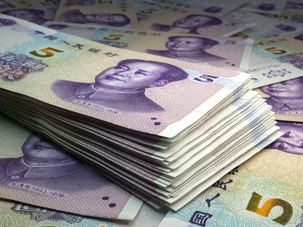 Money of China. Chinese renminbi bills. CNY banknotes. 5 yuan. Business, finance, news background.