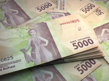 Endonezya 'nın parası. Endonezya rupiası banknotları. IDR banknotları. 5000 rupi. İş, finans, haber geçmişi.