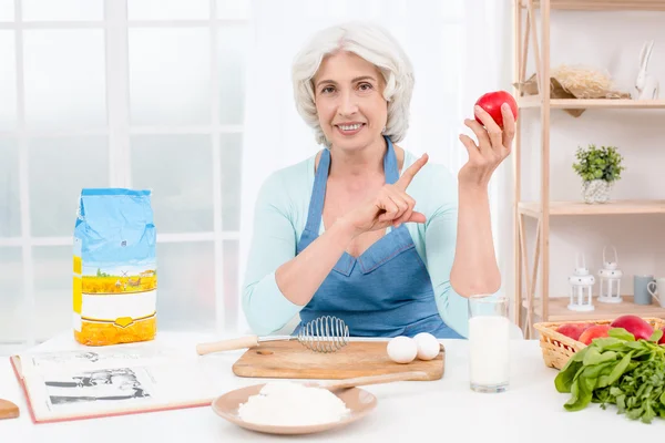 Nice looking adult woman at kitchen