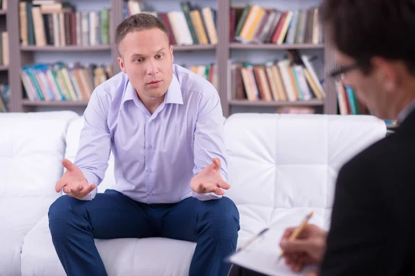Man talking to his psychologist