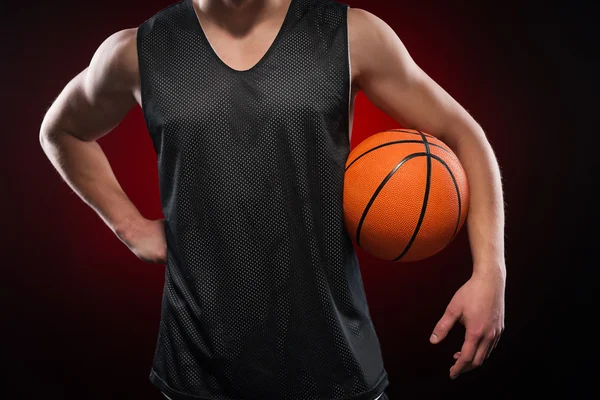 Basketball athlete gripping the ball — Stock Photo, Image