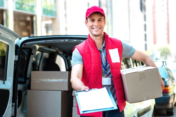 Courier Delivering Package By Van