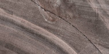 Cilalanmış kahverengi mermer. Gerçek doğal mermer taş dokusu ve yüzey arkaplanı. kahve mermer taş dokusu