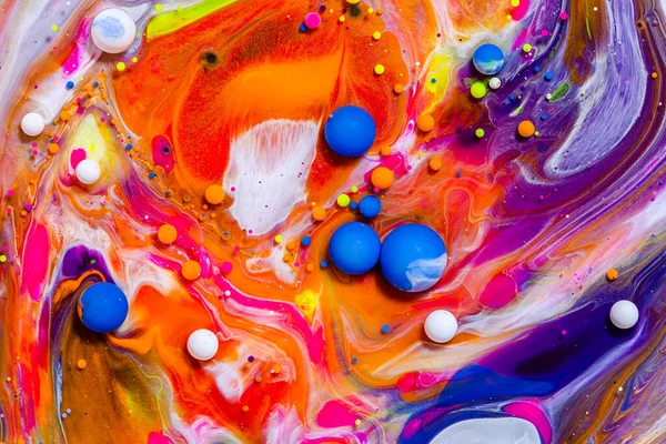 Fluid art texture. Background with abstract swirling paint effect. Liquid acrylic picture with flowing bubbles. Mixed paints for posters or wallpapers. Vibrant overflowing colors.