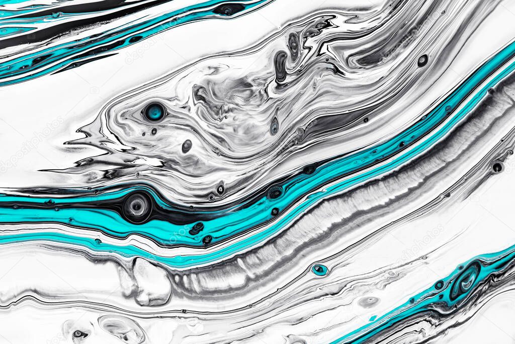 Fluid art texture. Background with abstract swirling paint effect. Liquid acrylic picture that flows and splashes. Mixed paints for background or poster. Gray, white and azure overflowing colors.