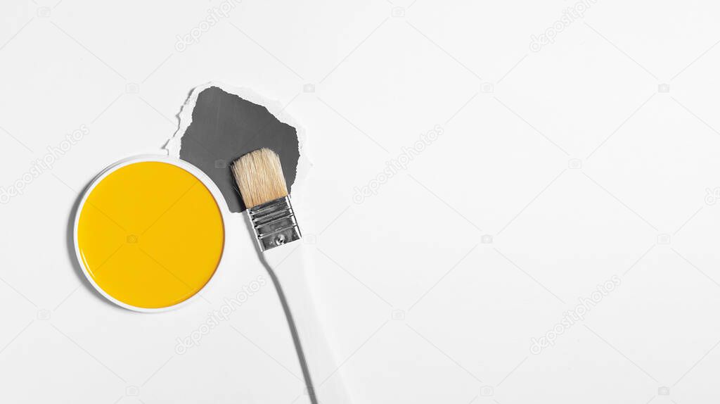 White brush on light background with trend and mod colors of 2021 year. Minimalistic picture for article, banner or poster. Yellow and gray palette.