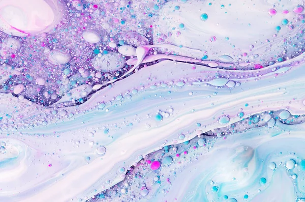 Fluid art texture. Background with abstract swirling paint effect. Liquid acrylic artwork with flowing bubbles. Mixed paints for baner or wallpaper. Lavender, aquamarine and white overflowing colors.