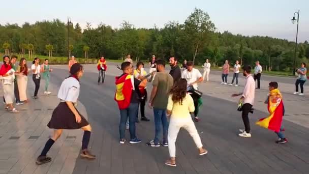 World Youth Day 2016. Young pilgrims from many countries singing and dancing in a circle — Stock Video