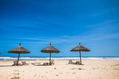Beautiful landscape of pristine beaches and sea through Hai Van Pass from Da Nang to Hue, Vietnam. Sunny day scenery.
