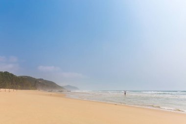 Handsome man in Quan Lan beach - Bai Bien - island, Bai Tu Long Bay, Vietnam. Seaside scenery photo taken in south east Asia, Ha Long area.