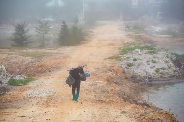 Beautiful landscape with a woman of Quan Lan island, Bai Tu Long Bay, Vietnam. Seaside scenery photo taken in south east Asia, Ha Long area.