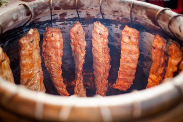 Thai clay oven full of ribs