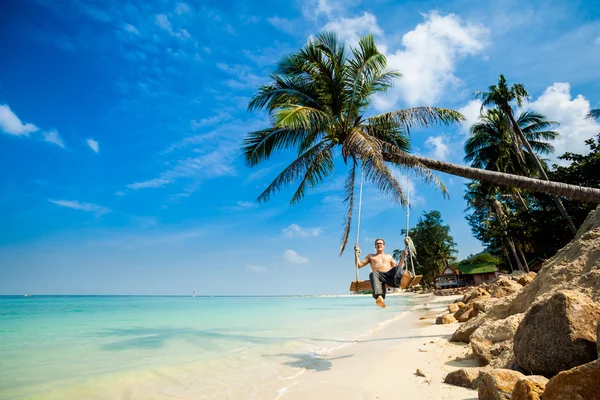 Young man on swing — Stock Photo, Image