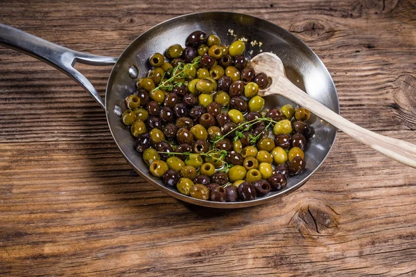 Skillet with fresh olives cooking — Stock Photo, Image
