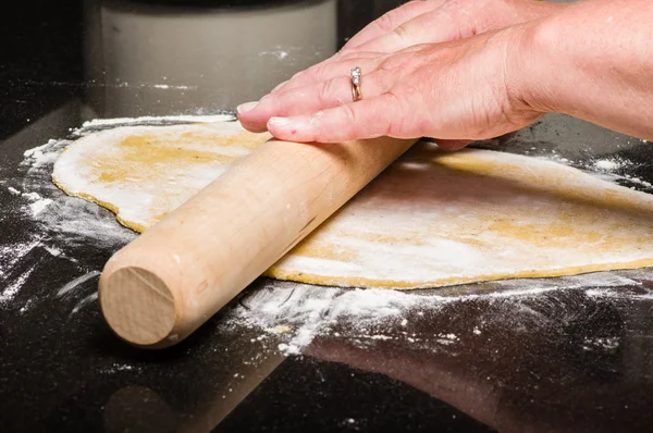 Homemade dough being formed into pasta — Stock Photo, Image