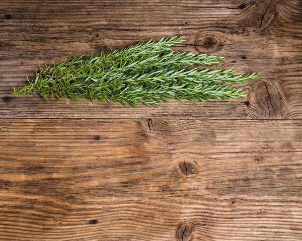 Bundle of fresh roasemary on a table — Stock Photo, Image