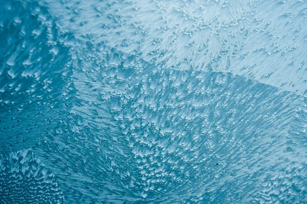 Blue ice frost on glass pane — Stock Photo, Image