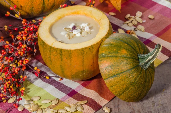 Pumpkin soup with fall decorations — Stock Photo, Image