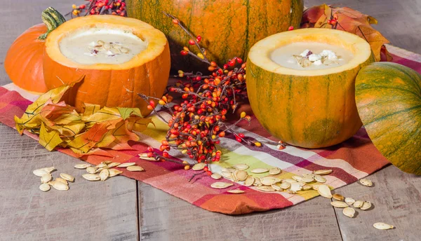 Pumpkin soup with fall decorations — Stock Photo, Image