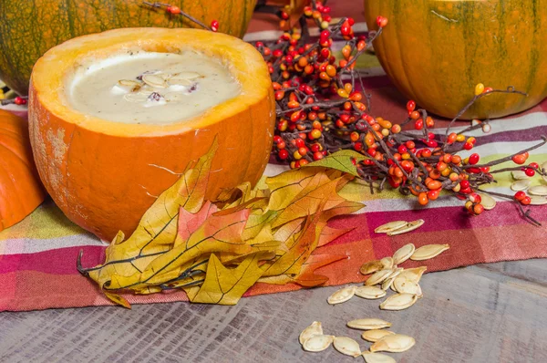 Pumpkin soup with fall decorations — Stock Photo, Image