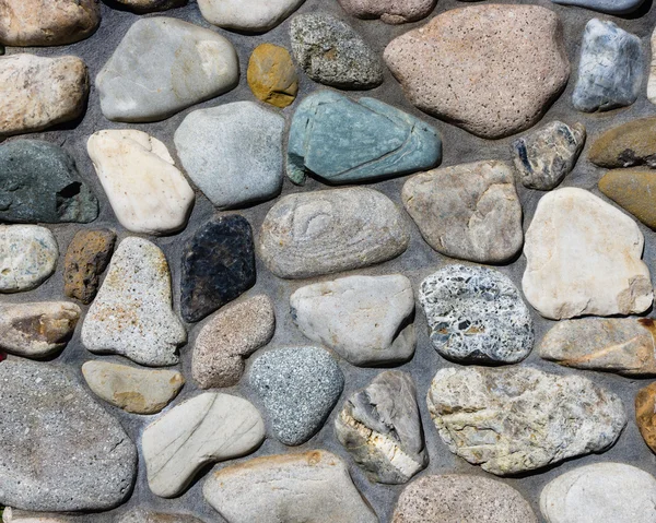 River rock stone wall with mortar joints — Stock Photo, Image