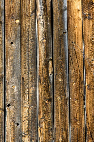 Vertical weathered knotty pine siding — Stock Photo, Image