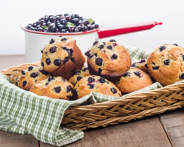 Wicker basket of berry muffins — Stock Photo, Image