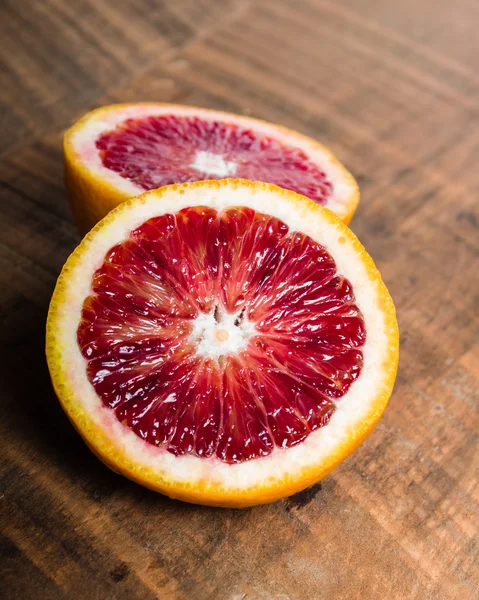 Blood orange halves on table — Stock Photo, Image