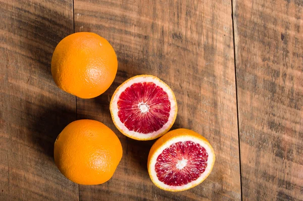 Blood oranges with cut showing interior — Stock Photo, Image