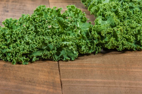 Curly kale leaves for border — Stock Photo, Image