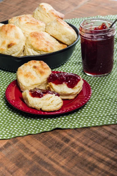 Fresh baked biscuits and jam or preserves — Stock Photo, Image