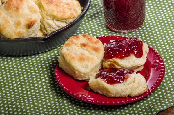 Fresh baked biscuits and jam or preserves — Stock Photo, Image